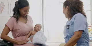MUSC new mother with infant and doctor cropped 157